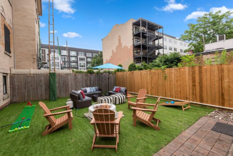 Private backyard at The Garden Retreat with outdoor seating and lawn